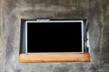 Wide screen TV on wooden commode near grey wall. Royalty Free Stock Photo