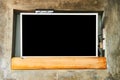 Wide screen TV on wooden commode near grey wall. Royalty Free Stock Photo