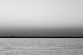 A wide seascape shoot with very well composed colors and black horizon from izmir bay - black and white