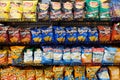 Wide selection of potato chips on shelf display Royalty Free Stock Photo