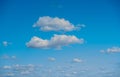 Wide shot of a beautiful bright blue sky with fluffy clouds Royalty Free Stock Photo