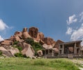 Wide shot on boulders and Nandi Monolith temple, Hampi, Karnataka, India