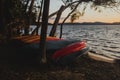 Wide Shot Of Canoes And Kayaks Lying In Front Of A Lake Royalty Free Stock Photo