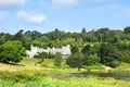 Wide shot capturing the Caerhays Castle in St Michael Caerhays, Cornwall, England, United Kingdom