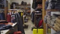 Wide shot of clothing store interior. Luxurious shop with pricey goods in shopping center. Consumerism and business