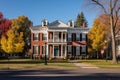 wide shot of a colonial revival mansion focusing on a distinctive fanlight