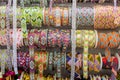 Wide shot of different rolls of ribbons with unique designs and patterns in a rack Royalty Free Stock Photo