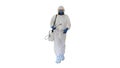 Disinfectant walking with antiviral liquid tank looking to camera on white background. Royalty Free Stock Photo