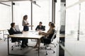 Wide shot of diverse business team meeting at large table Royalty Free Stock Photo