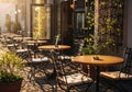 Empty cafe terrace with neatly arranged chairs in early spring sunlight Royalty Free Stock Photo