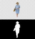 Beautiful pregnant woman wearing big hat walking and touching he Royalty Free Stock Photo