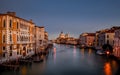Wide shot of the Grand Canal in Venice, Italy with lit up dock lights in the early morning Royalty Free Stock Photo