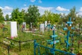Graves and trees in Russian provincial Cemetery Royalty Free Stock Photo