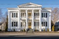 wide shot of greek revival building with evenly spaced windows