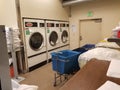 Wide shot of hotel laundry room