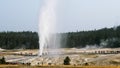 Wide shot of the impressive beehive geyser erupting in yellowstone