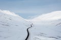 Wide Shot of Jeep Car driving on Iceland Road with Snow white Mountains and Sunset countryside, Winter. Road trip in Nordic Royalty Free Stock Photo