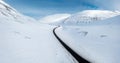 Wide Shot of Jeep Car driving on Iceland Road with Snow white Mountains and Sunset countryside, Winter. Road trip in Nordic Royalty Free Stock Photo