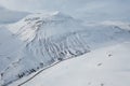 Wide Shot of Jeep Car driving on Iceland Road with Snow white Mountains and Sunset countryside, Winter. Road trip in Nordic Royalty Free Stock Photo