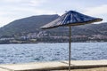 Wide shot of multiple sun shadings on the coastline at summertimeClose-up wide shot of sun shading on the coastline at summertime