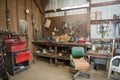 Wide shot of an old barn` s workbench with different types of tools Royalty Free Stock Photo