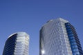 Wide shot of a pair of twins corporate blue office high-rise buildings with a striped design.