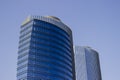 Wide shot of a pair of twins corporate blue office high-rise buildings with a striped design.