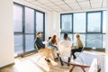 Wide shot of people giving support to depressed crying man at group psychological treatment sitting in circle. Royalty Free Stock Photo