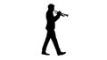 Silhouette Stylish jazz man walking and playing the trumpet. Royalty Free Stock Photo