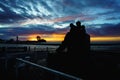 Wide shot of the silhouette of Fisherman's Memorial, Port Dover in Ontario Canada during sunset