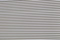 Wide shot of silver corrugated metal with bolts Royalty Free Stock Photo