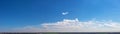 Wide sky panorama with scattered cumulus clouds Royalty Free Stock Photo