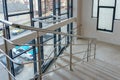 A wide staircase along the large windows in an office building. Modern interior of the lobby of an office building with large Royalty Free Stock Photo