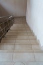 A wide staircase along the large windows in an office building. Modern interior of the lobby of an office building with large Royalty Free Stock Photo