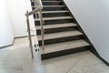 A wide staircase along the large windows in an office building. Modern interior of the lobby of an office building with large Royalty Free Stock Photo