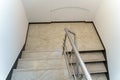 A wide staircase along the large windows in an office building. Modern interior of the lobby of an office building with large Royalty Free Stock Photo