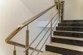 A wide staircase along the large windows in an office building. Modern interior of the lobby of an office building with large Royalty Free Stock Photo