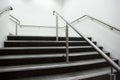 Wide staircase with chrome handrails