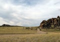 Wide steppe with yellow grass under a blue sky with white clouds Sayan mountains Siberia Russia Royalty Free Stock Photo