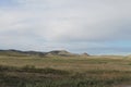 Wide steppe with yellow grass under a blue sky with white clouds Sayan mountains Siberia Russia Royalty Free Stock Photo