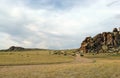 Wide steppe with yellow grass under a blue sky with white clouds Sayan mountains Siberia Russia Royalty Free Stock Photo