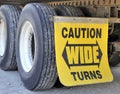 Wide turns sign and tires on semi-trailer Royalty Free Stock Photo