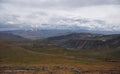 Wide valley with yellow grass on the Ukok plateau, under a cloudy gloom dramatic sky Royalty Free Stock Photo