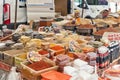 wide variety of spices, nuts and dried fruits on the shelves of local street market traders