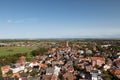 Wide view along the buildings and the grass field under a blue sky on the northern sea island borkum germany Royalty Free Stock Photo