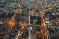 Wide View of Beautiful Berlin, Germany Cityscape after Sunset with lit up Streets and Alexanderplatz TV Tower, Aerial