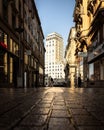 Wide view of a bustling city street, featuring a tall buildings in Lausanne