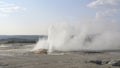 Wide view of clepsydra geyser erupting in yellowstone