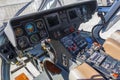Wide view, a cockpit of a small helicopter, a control panel and a steering wheel. Royalty Free Stock Photo