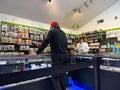 Bothell, WA USA - circa February 2023: wide view of a customer checking out inside Herbal Nation cannabis shop